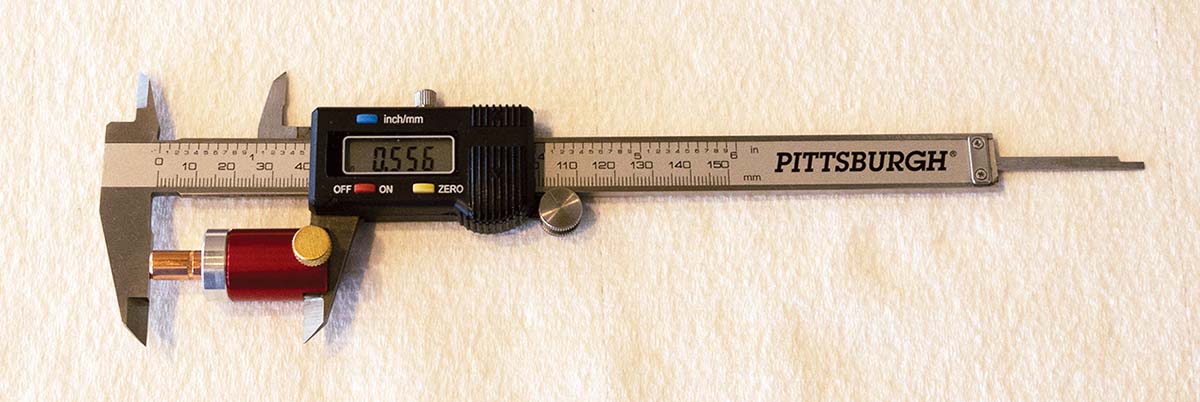 Measurement setup for bullet length measured from base to ogive (BOAL).